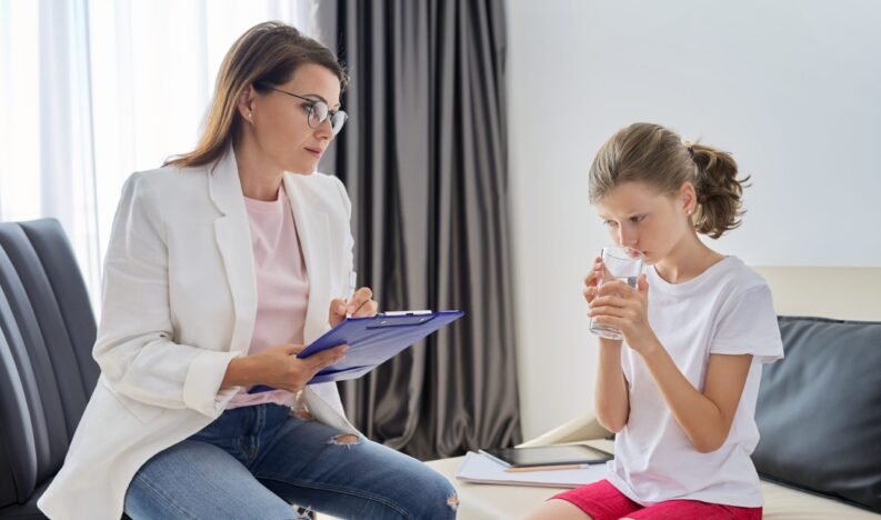 Communication session of school psychologist and girl 10, 11 years. Child tells psychotherapist his experiences, mental health of children