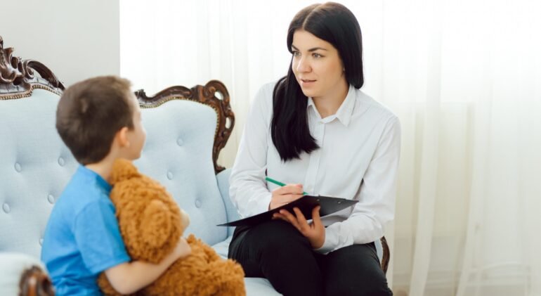 The concept of child psychology. A boy at the psychologist