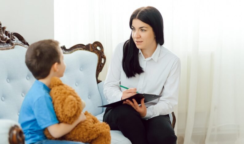 The concept of child psychology. A boy at the psychologist